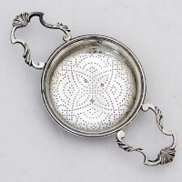 Lot 392 - George II silver lemon strainer, London 1759, the