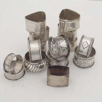 Lot 413 - Nine various silver napkin rings and a set of six