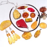 Lot 431 - Fifteen various amber brooches and pendants