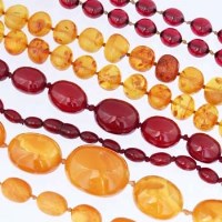 Lot 432 - Four amber necklaces of ovoid beads