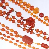 Lot 434 - Two copal necklaces with pendants and a facetted