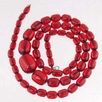 Lot 435 - Red amber bead necklace.
