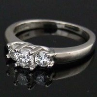 Lot 455 - 14ct white gold three-stone diamond ring.