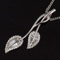 Lot 474 - 18ct white gold and diamond leaf spray pendant on