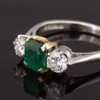 Lot 478 - 18ct white gold emerald and diamond three-stone