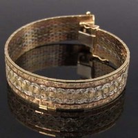 Lot 504 - Tri-colour 9ct gold strap bracelet, 18.5cm, 30.8g
