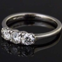 Lot 506 - 950 platinum three-stone diamond ring.