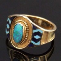 Lot 520 - Arts & Crafts gold and enamel opal ring.
