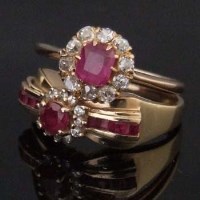 Lot 521 - 14ct gold ruby and diamond cluster ring in a