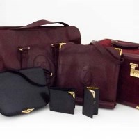 Lot 527 - A collection of Cartier hand luggage and bags