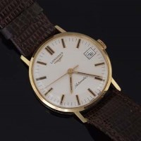 Lot 535 - Early 1970's Longines man's 18ct wrist watch.