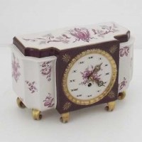 Lot 750 - Porcelain mantel clock and key