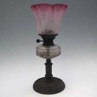 Lot 26 - Oil lamp with etched ruby shade.
