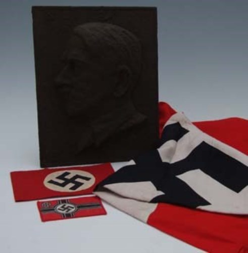 Lot 69 - Cast iron plaque depicting Adolf Hitler together with Nazi arm band, flag and patch (4).