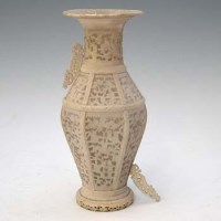 Lot 91 - Ivory reticulated vase complete with dome.
