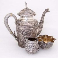 Lot 94 - Anglo-Indian 'eastern silver' three piece teaset