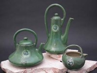 Lot 173 - Moorcroft flamminian teapot, coffee pot, and a cream jug circa 1910
