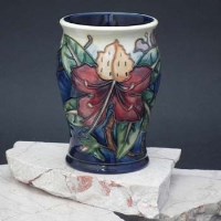 Lot 188 - Moorcroft vase decorated with a modern hibiscus