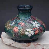 Lot 193 - Moorcroft centenery carousel vase by Rachael