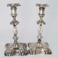 Lot 214 - Pair of filled silver candlesticks.
