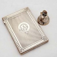 Lot 217 - Silver card case and bell.