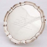 Lot 253 - Silver waiter engraved with a dedication.