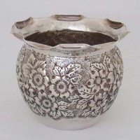 Lot 254 - Silver vase embossed with flowers.