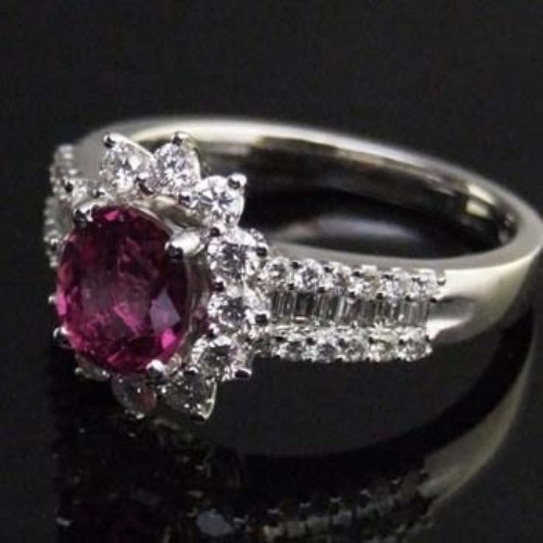 Lot 357 - Thai natural ruby and diamond oval cluster ring