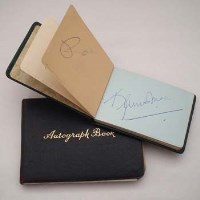 Lot 98 - Two albums of assorted autographs to include Stirling Moss, Jackie Stewart and Graham Hill.