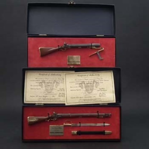 Lot 116 - Two boxed pewter ¼ scale Sharpe weapons.