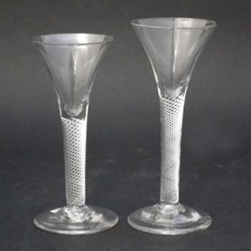 Lot 138 - Two mercury twist wine glasses.