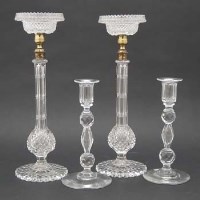 Lot 146 - Two pairs of cut glass candlesticks.