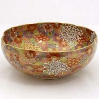 Lot 199 - Japanese earthenware floral bowl and stand.