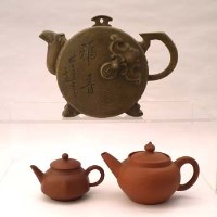 Lot 205 - Three Yixing teapots.