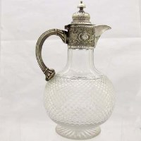 Lot 349 - Cut glass and silver plated claret jug.