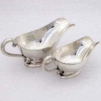 Lot 357 - Two sterling silver sauce boats.