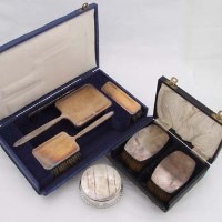 Lot 379 - Cased dressing table set; cased brushes; powder