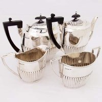 Lot 393 - Silver Walker & Hall four piece tea set.