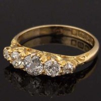 Lot 409 - Five stone diamond ring.