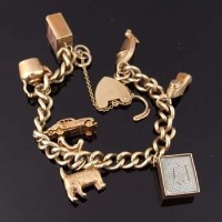 Lot 423 - 9ct Gold charm bracelet