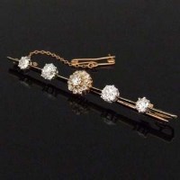 Lot 428 - Edwardian diamond bar brooch.