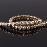 Lot 450 - 9ct gold and diamond line bracelet of 48 melee stones.