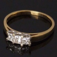Lot 479 - 18ct gold ring set with three square cut