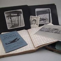 Lot 21 - Pilots log, photographs and related items from