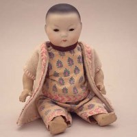 Lot 78 - AM oriental small doll.