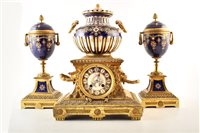 Lot 349 - A late 19th century French ormolu and ceramic mantel clock and garnitures