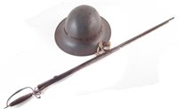Lot 186 - Fire watchers tin helmet dated April 1941 and Ro & Co Leeds, Also the remnants of a society sword.
