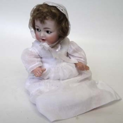 Lot 72 - S and M flirty eye baby doll.