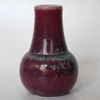 Lot 141 - Ruskin high fired vase   decorated with a purple glaze spotted in green, impressed marks to base, date code for 1933,15cm high