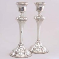 Lot 194 - Pair of filled silver candlesticks.